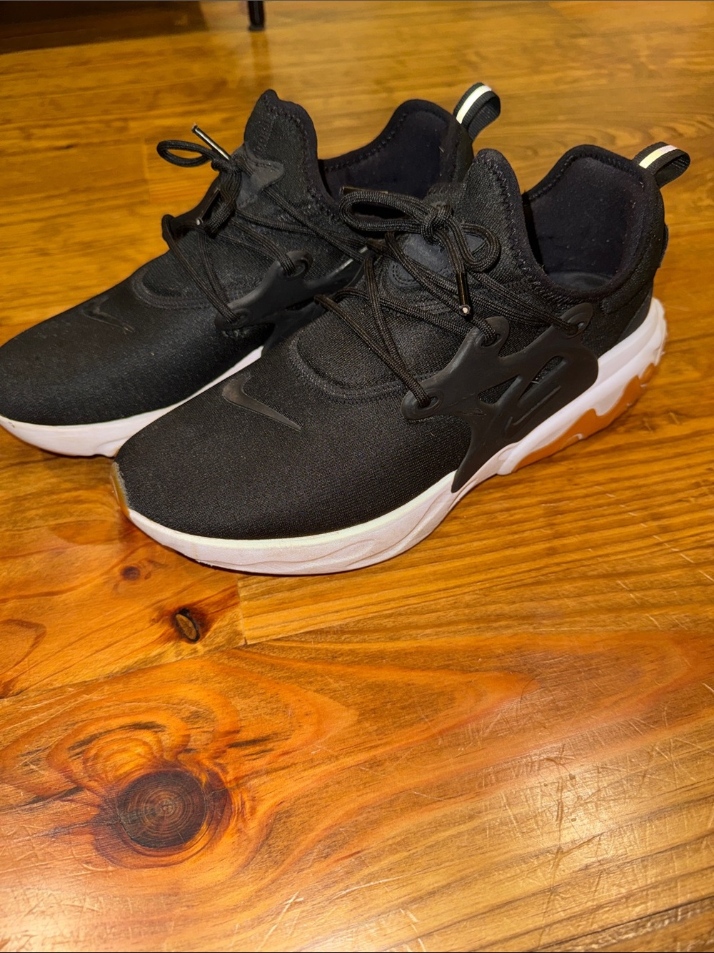 Nike Black Sneakers with White Midsole and Tan Outsole Accents